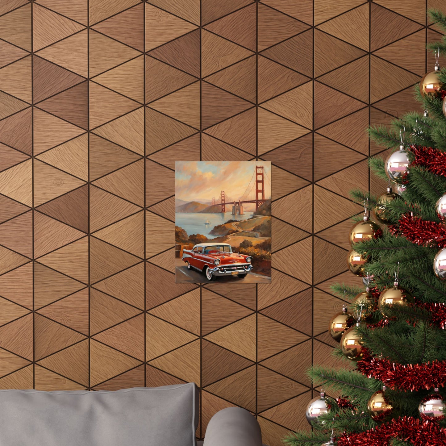Golden Gate Bridge vintage art print displayed on a textured wooden wall with a Christmas tree in the foreground