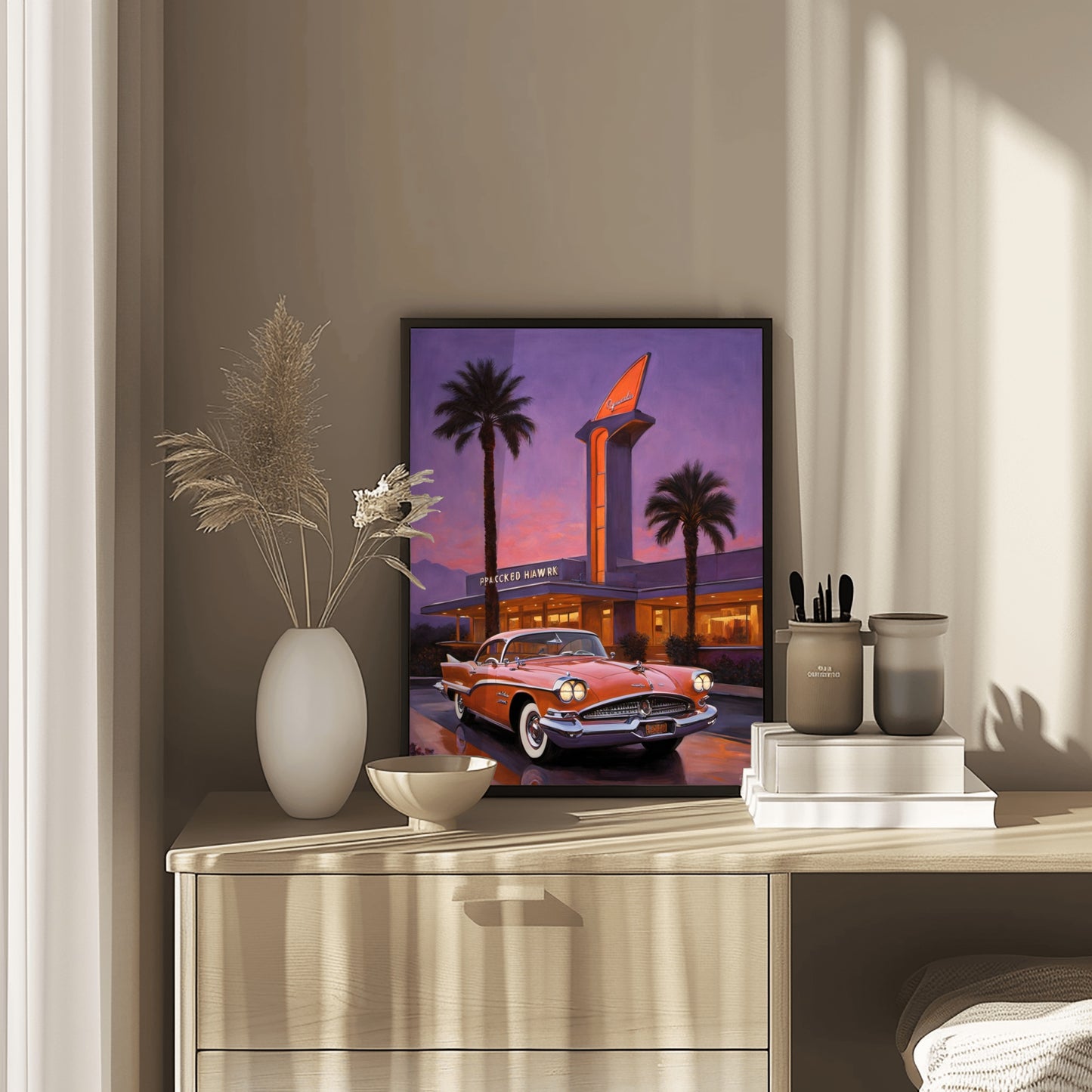 Neon hotel entrance artwork featuring a vintage car and palm trees displayed on a wooden dresser