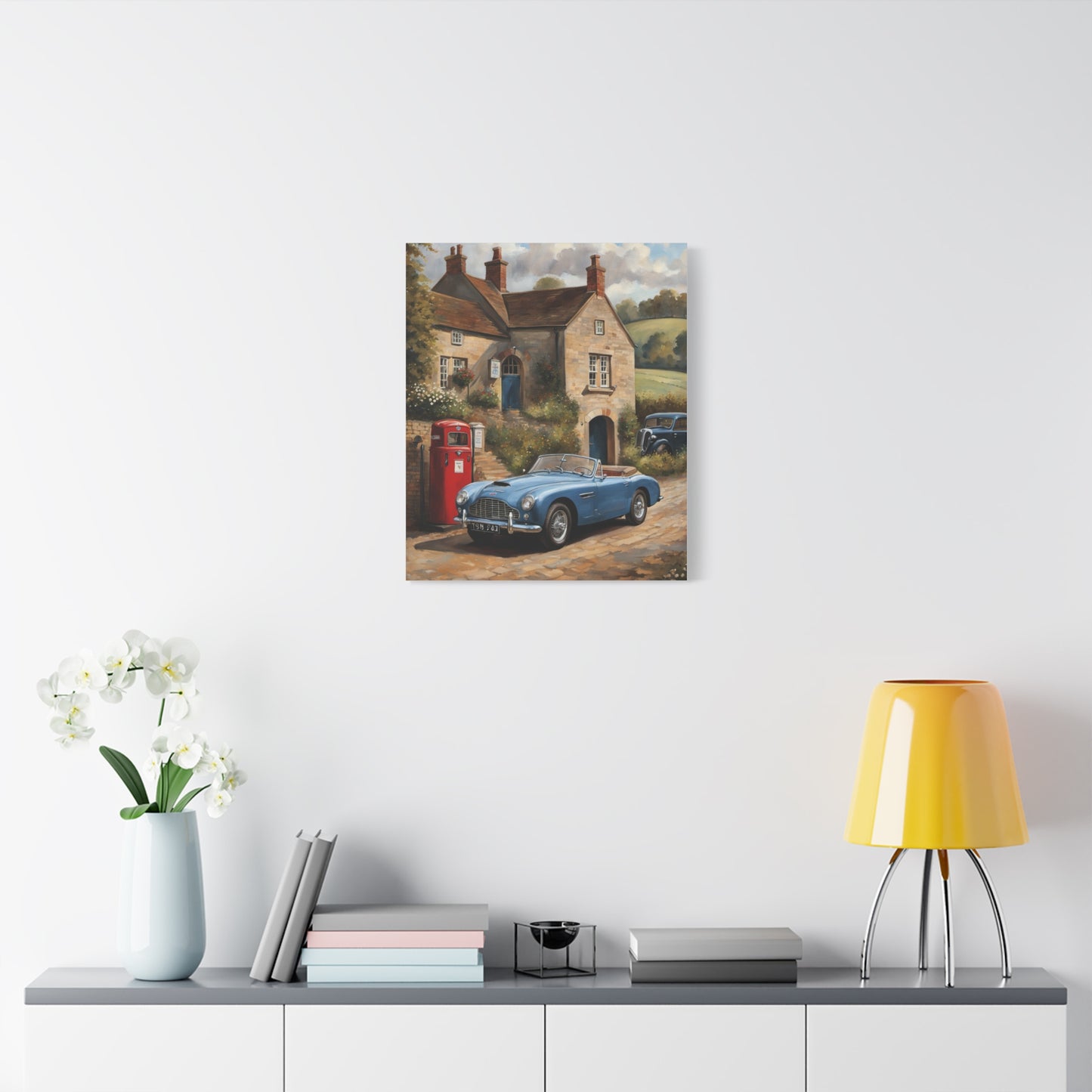 Old Car Canvas Print featuring a classic car near a vintage cottage and red phone booth