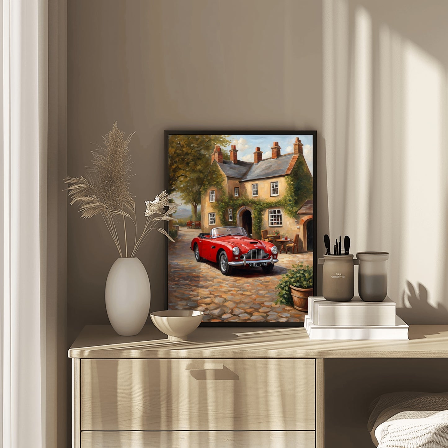 1950s convertible wall art featuring a red classic car on a cobblestone street in front of a vintage house