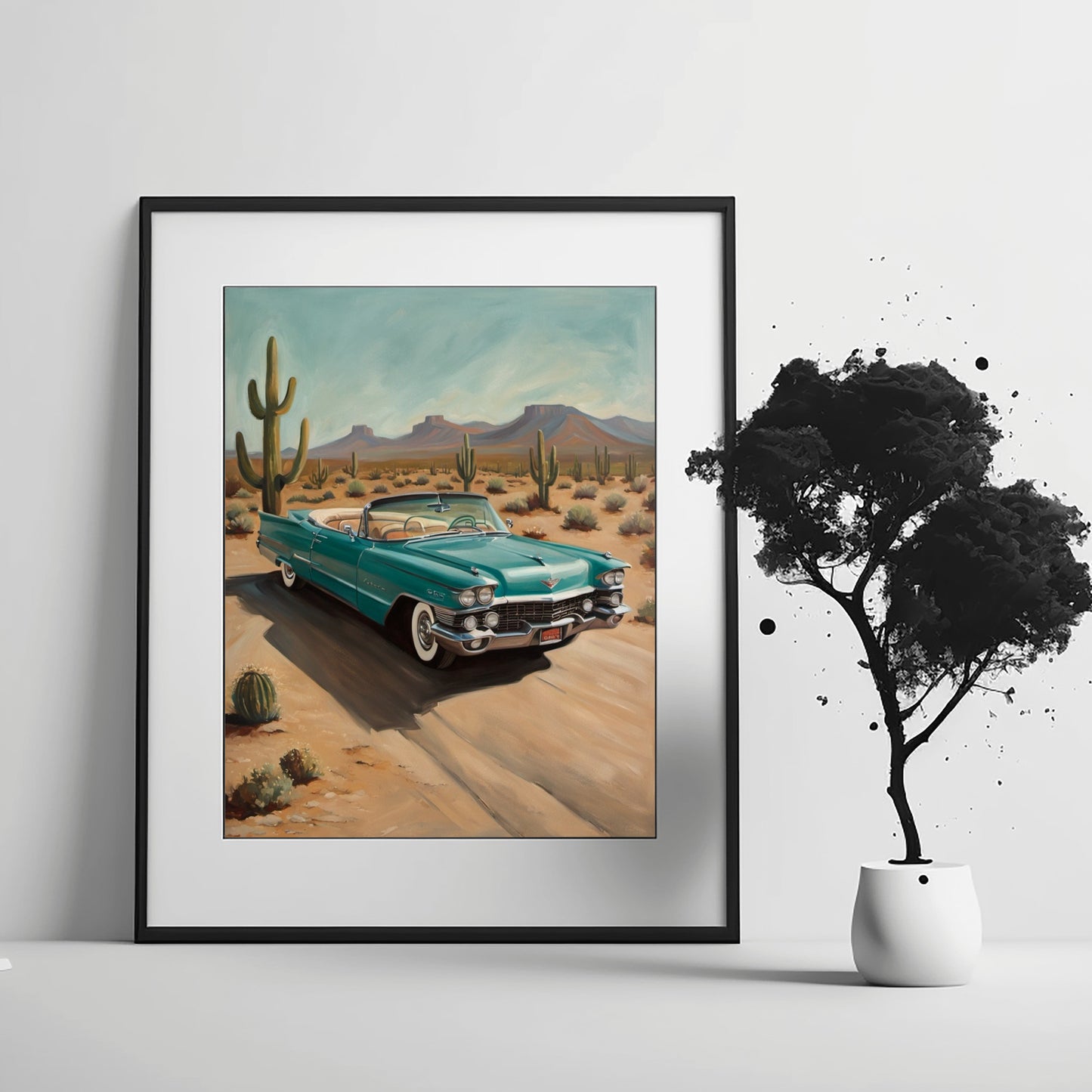 Vintage teal convertible car driving on desert highway wall art with cactus and mountains