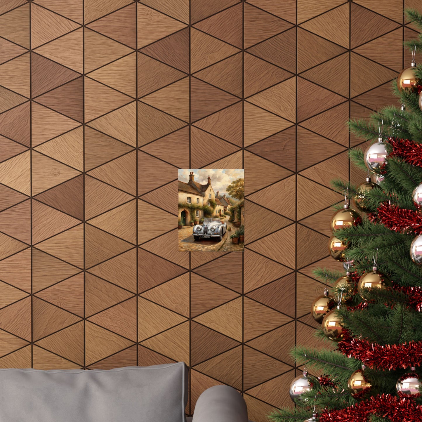 Vintage car poster wall art displayed on a textured brown geometric wall next to a Christmas tree