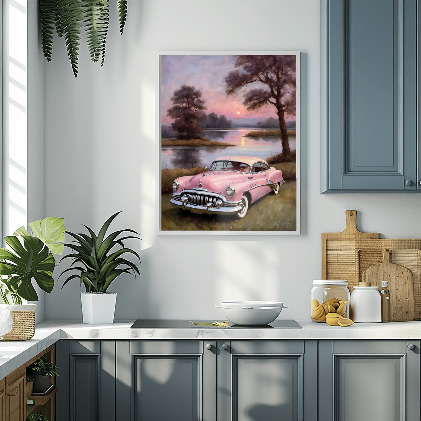 Vintage car wall art featuring a pink classic car near a lake at sunset hanging in a modern kitchen