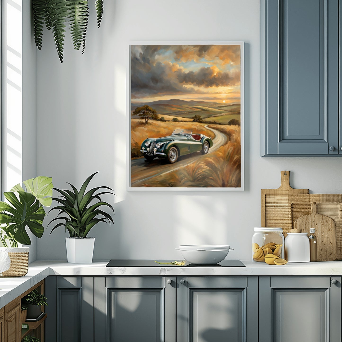 Vintage roadster oil painting by AquilVision hanging in a modern kitchen with gray cabinets and green plants