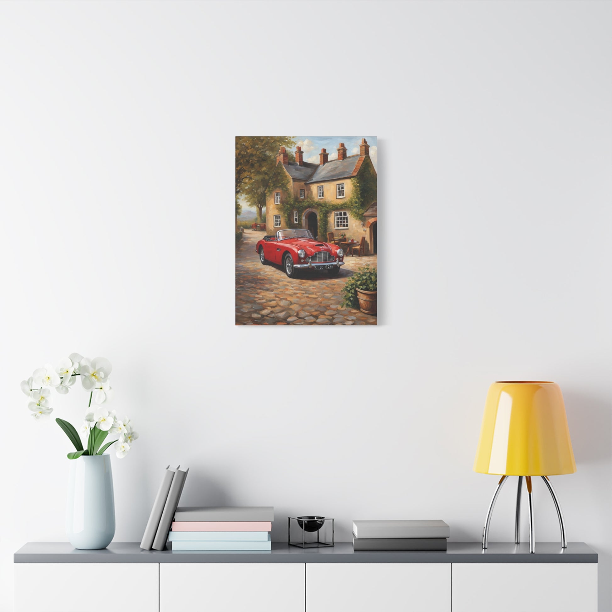 Charming Car Canvas featuring a red vintage car parked by a quaint cottage on a cobblestone path
