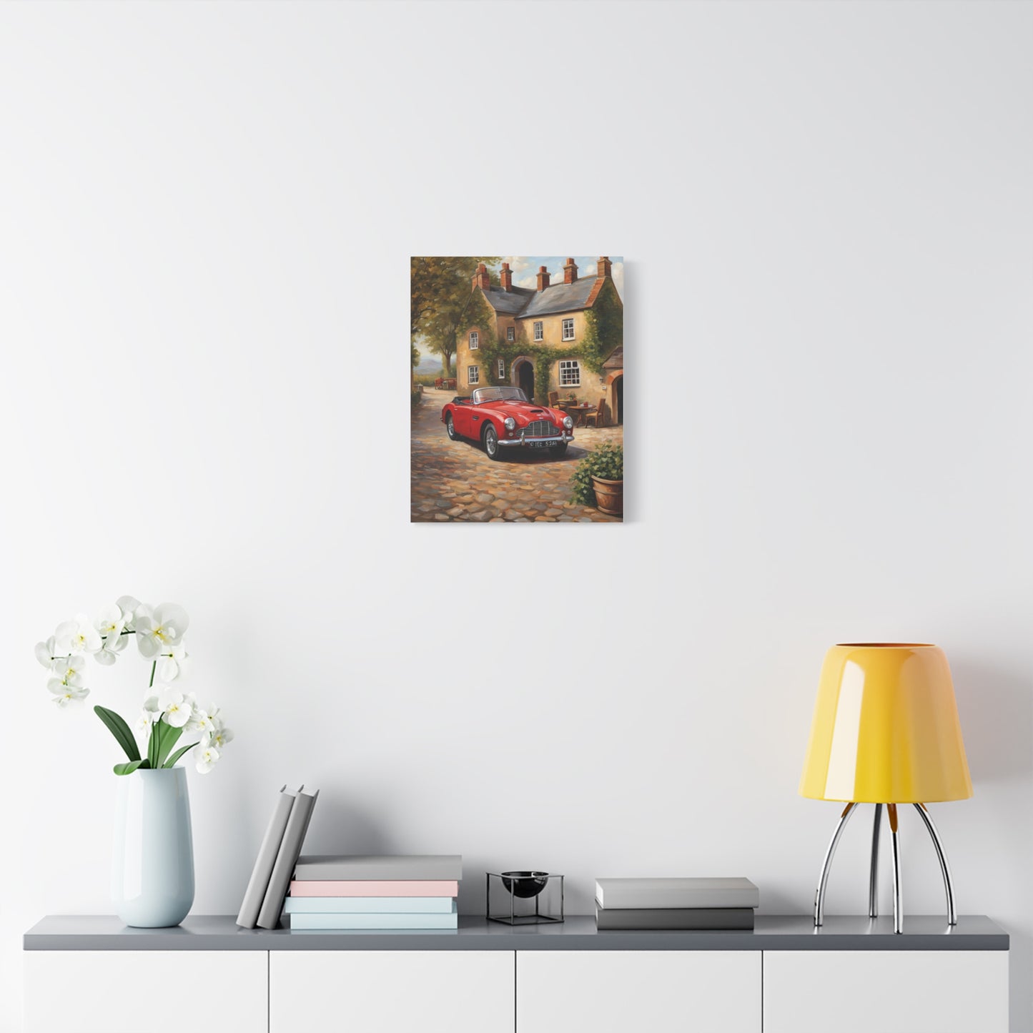 Charming Car Canvas artwork featuring a red classic car in front of a cottage with a garden