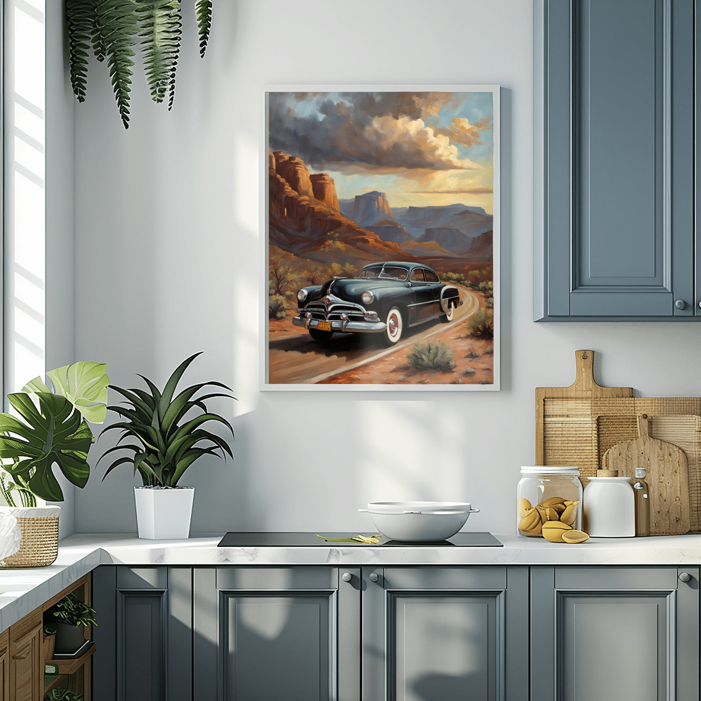 Classic car art print for home displayed in a modern kitchen with gray cabinets and green plants