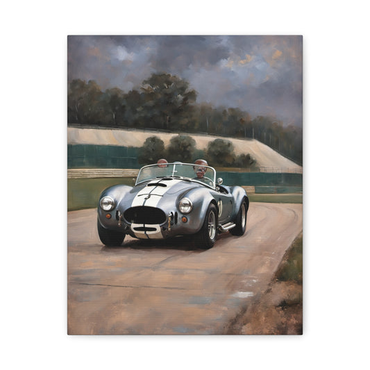 Classic Car Canvas Print featuring a vintage silver sports car on a scenic racetrack