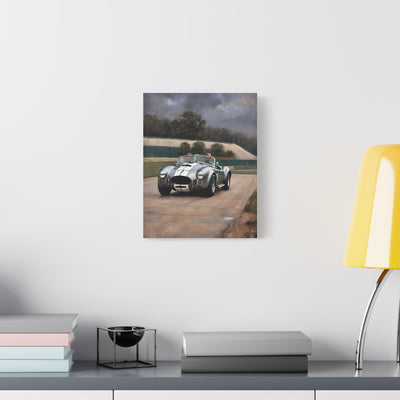 Classic Car Canvas Print featuring a vintage sports car on a racetrack backdrop