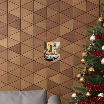 Italian landscape car poster framed on a geometric patterned wall near a Christmas tree