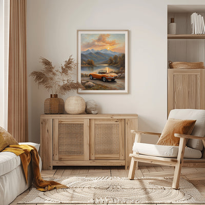 Lakeside sunset wall art featuring a vintage orange car parked by a lake with mountains in the background