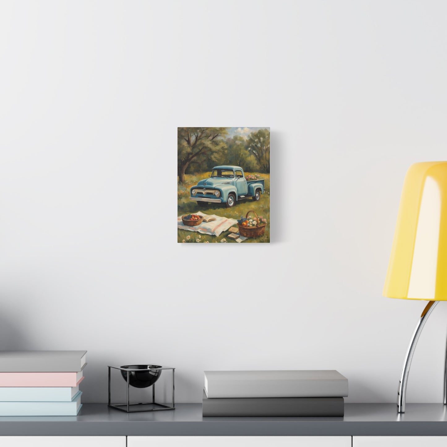 Old Truck Canvas Art Print featuring a vintage blue truck surrounded by nature and books on display