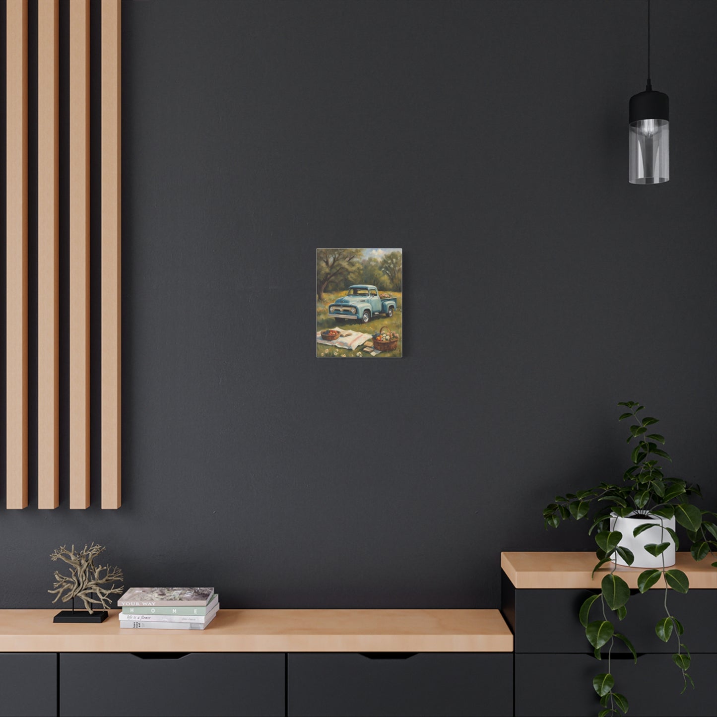 Old Truck Canvas Art Print displayed on a dark wall above a wooden console table with decor items