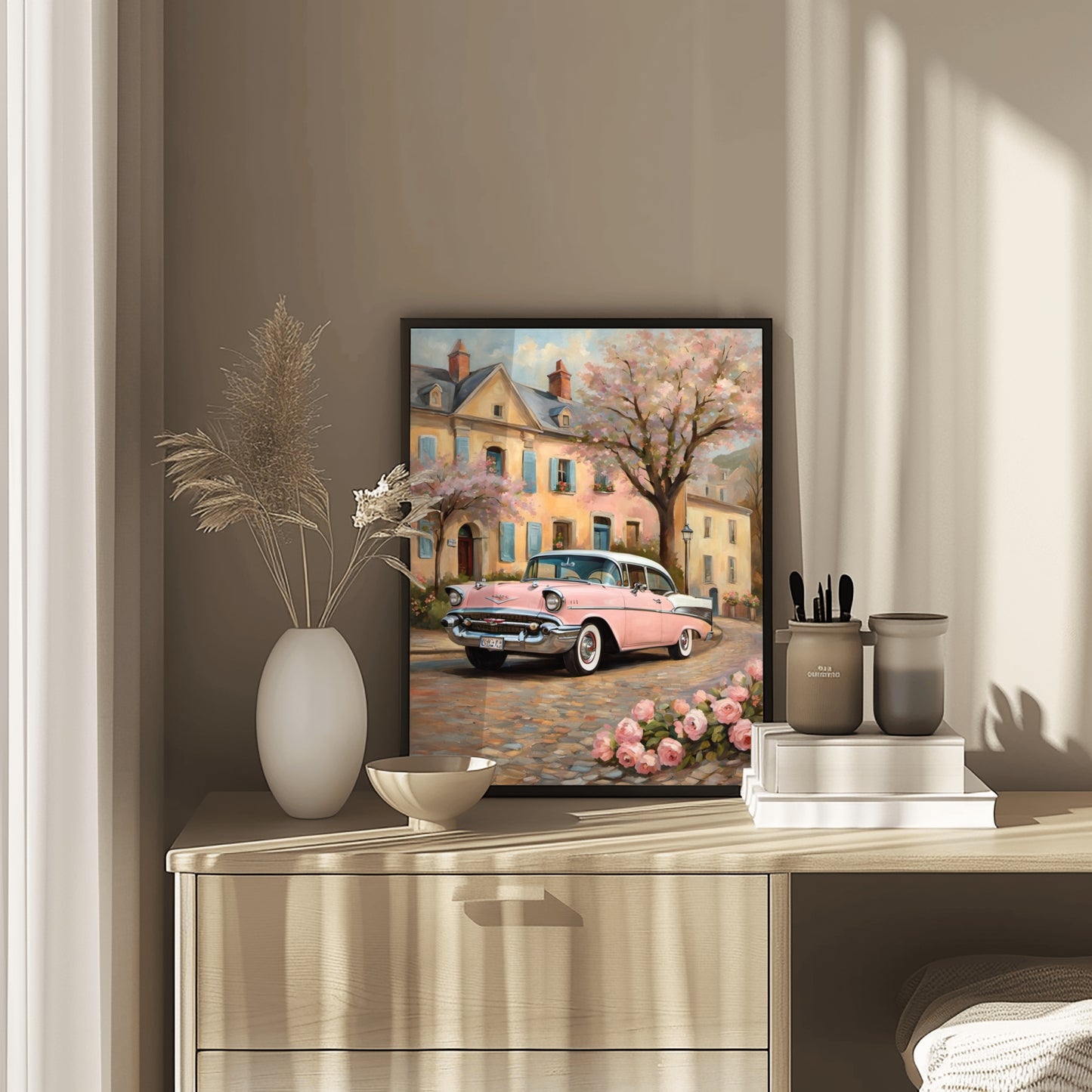 Romantic floral wall decor featuring a vintage pink car and blooming tree in front of pastel houses