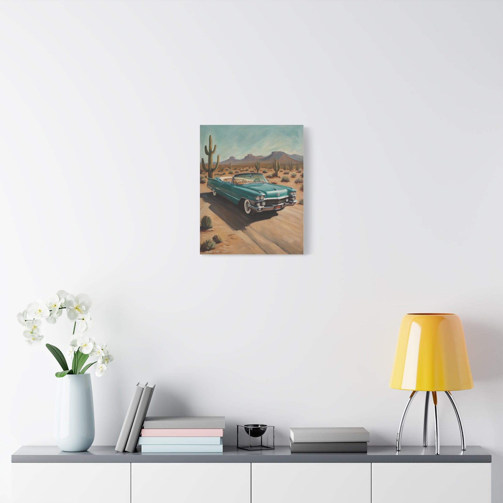 Vintage Car Canvas Art featuring a retro car in a desert landscape with cacti and mountains
