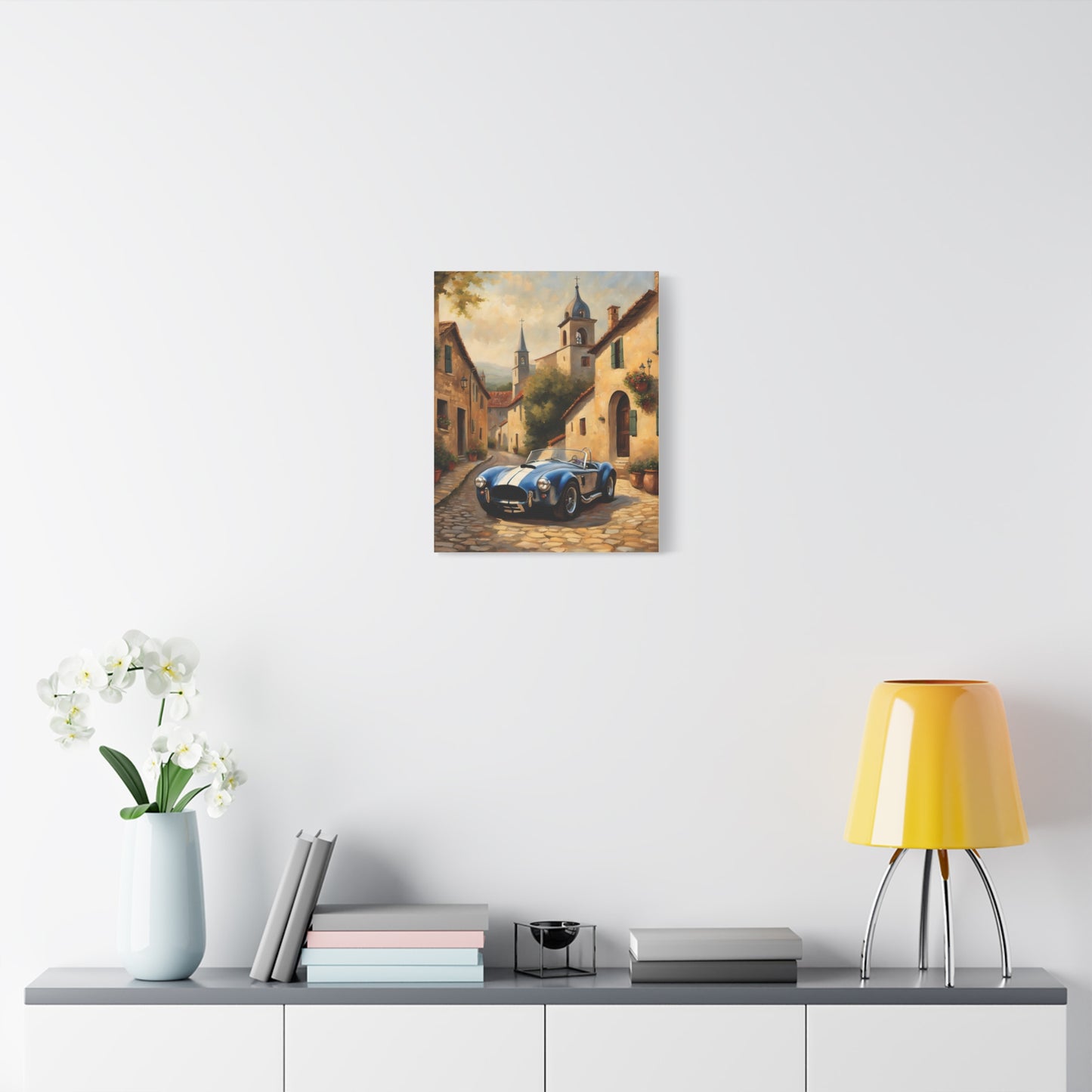 Vintage Car Canvas Art Print featuring a classic car on a cobblestone street surrounded by charming buildings