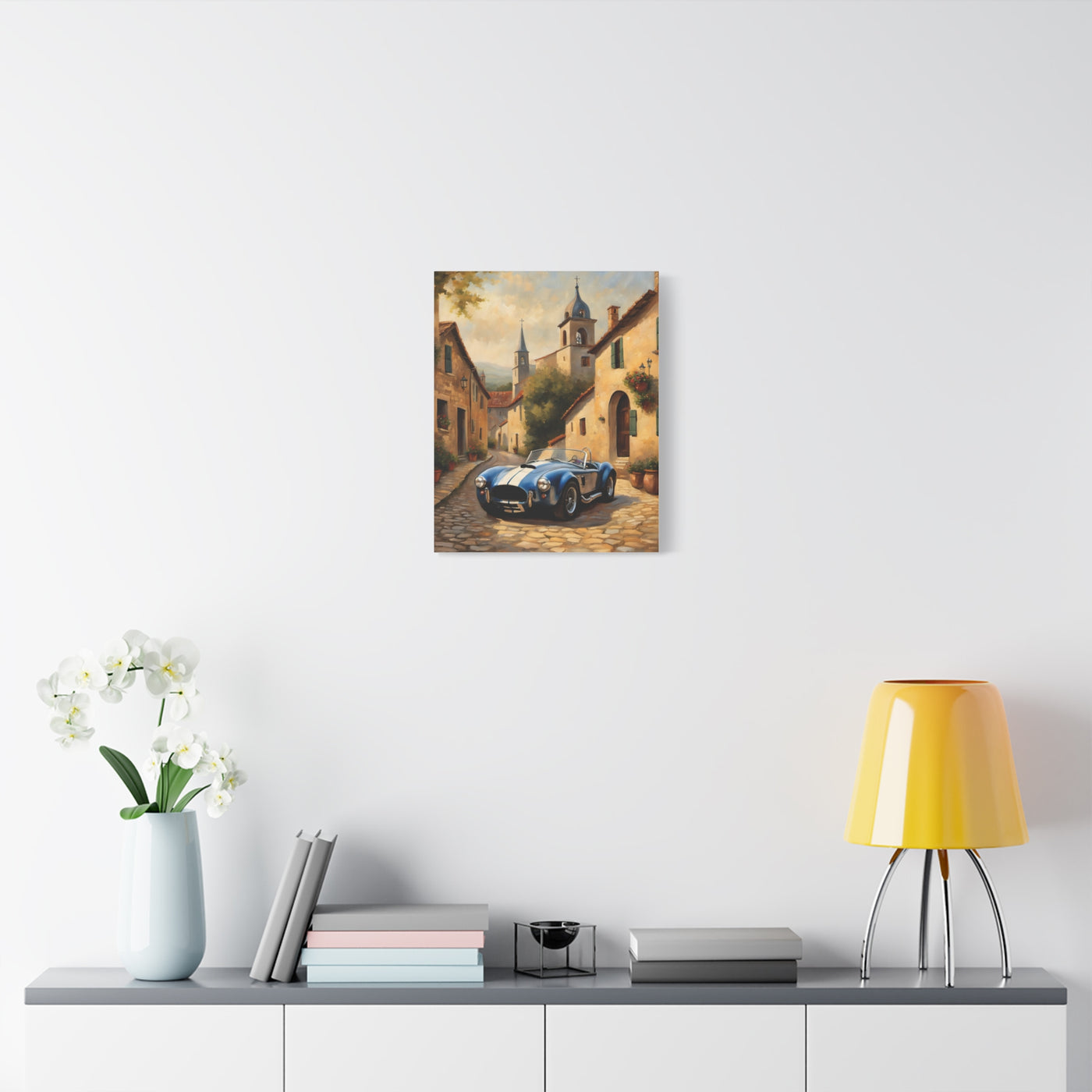 Vintage Car Canvas Art Print featuring a classic car on a cobblestone street surrounded by charming buildings