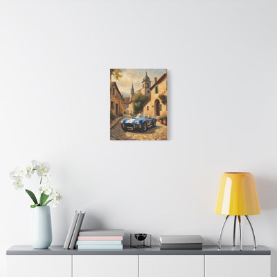 Vintage Car Canvas Art Print featuring a classic car on a cobblestone street surrounded by charming buildings