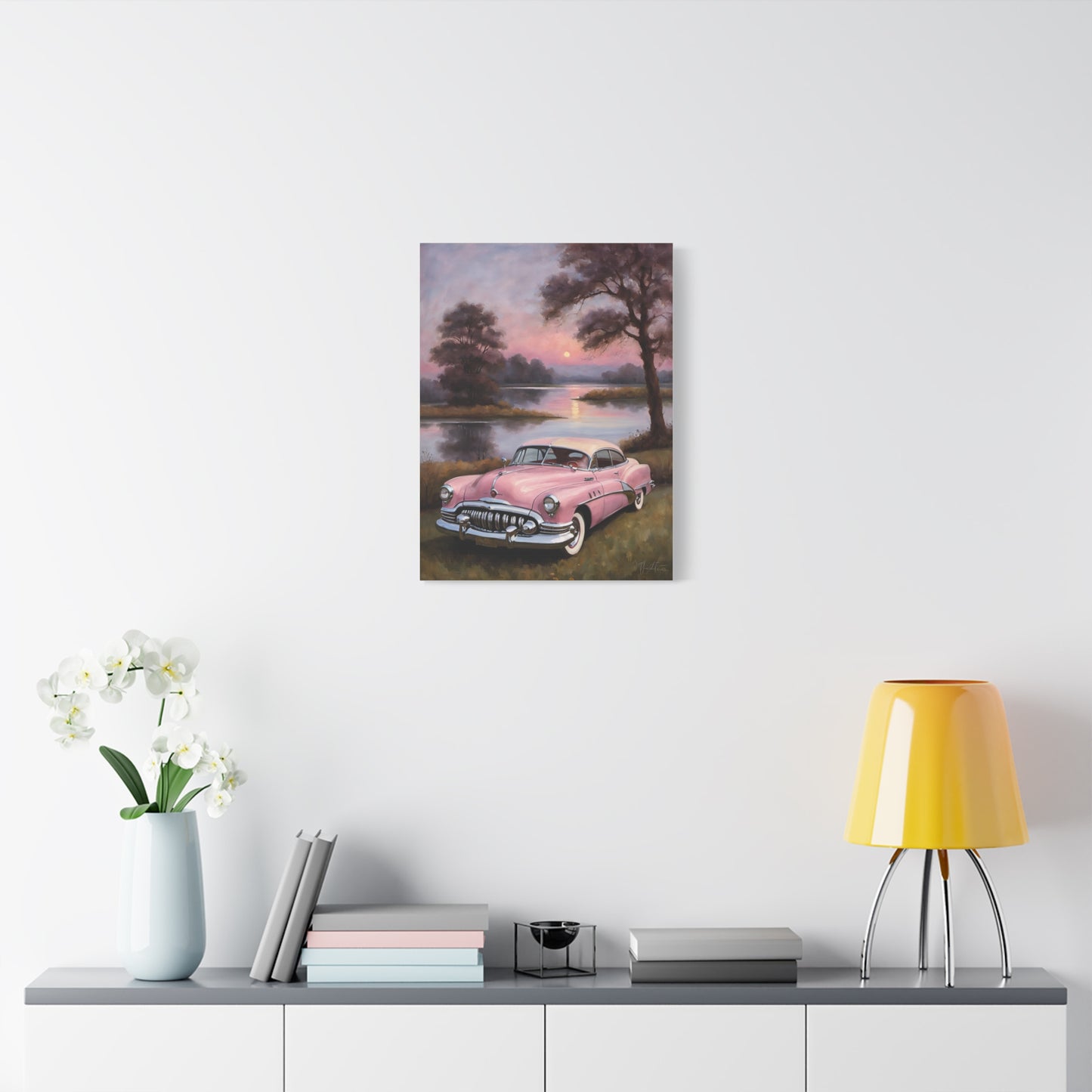 Vintage Car Canvas Art Prints featuring a pink classic car beside a serene lake at sunset