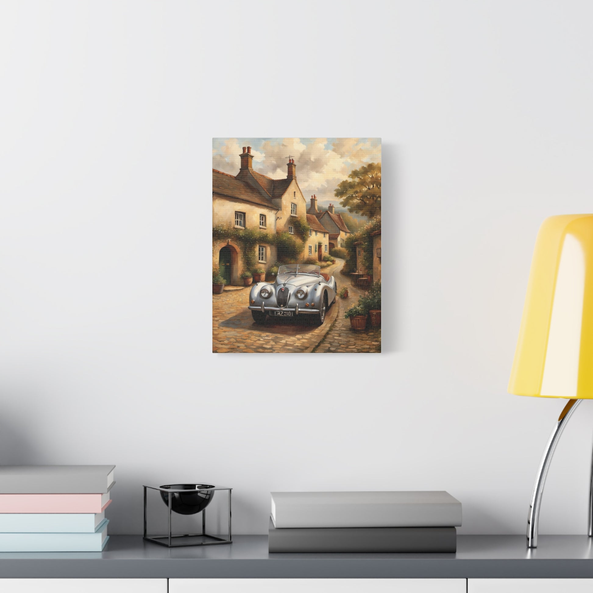 Vintage Car Canvas Art depicting a classic car in a picturesque village setting