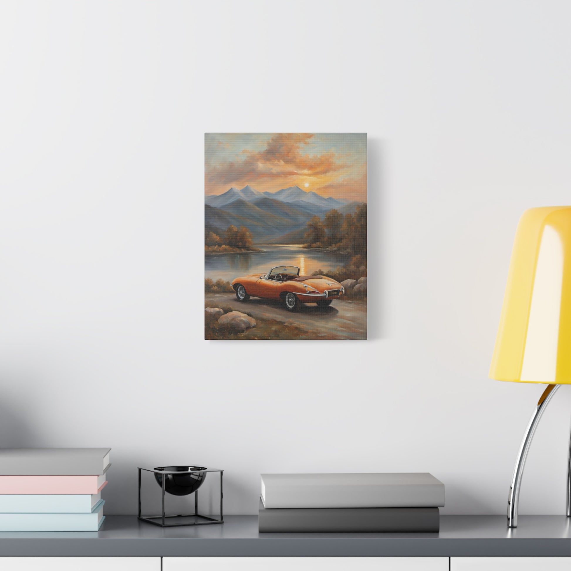 Vintage Car Canvas Print featuring a classic car by a scenic lakeside with mountains at sunset