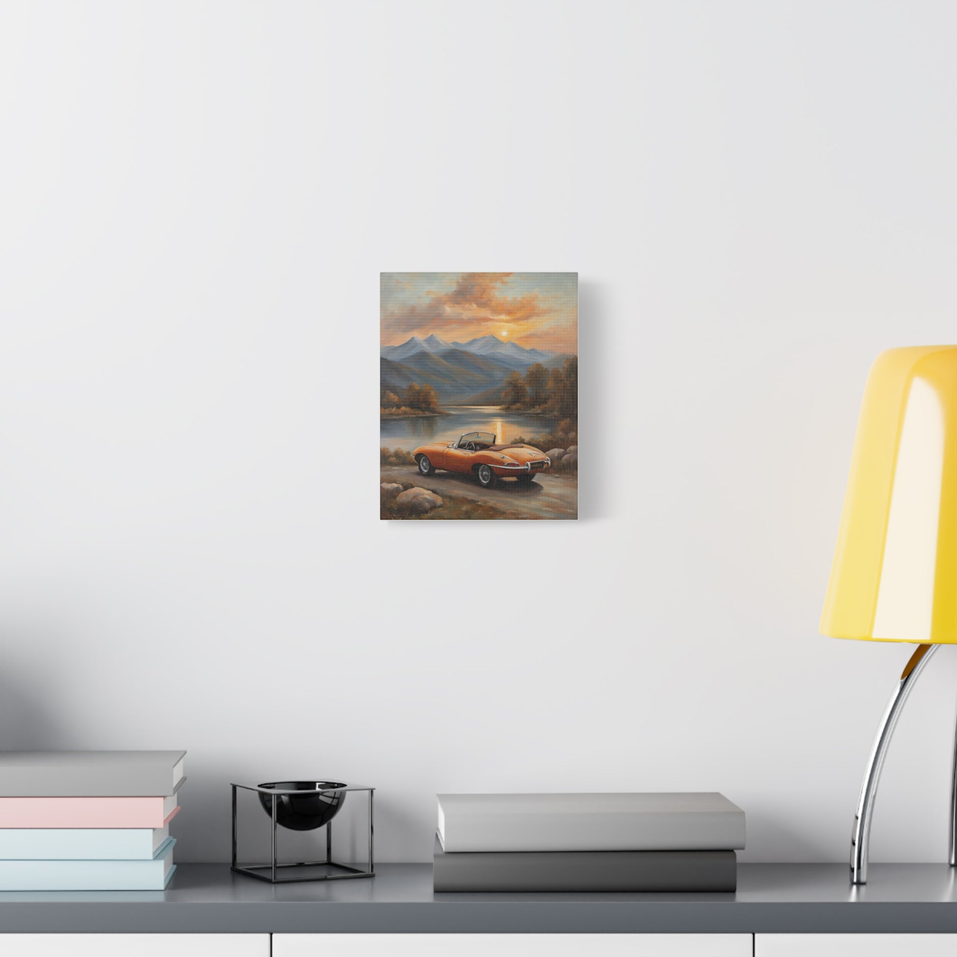 Vintage Car Canvas Print featuring a scenic landscape with mountains and a sunset backdrop