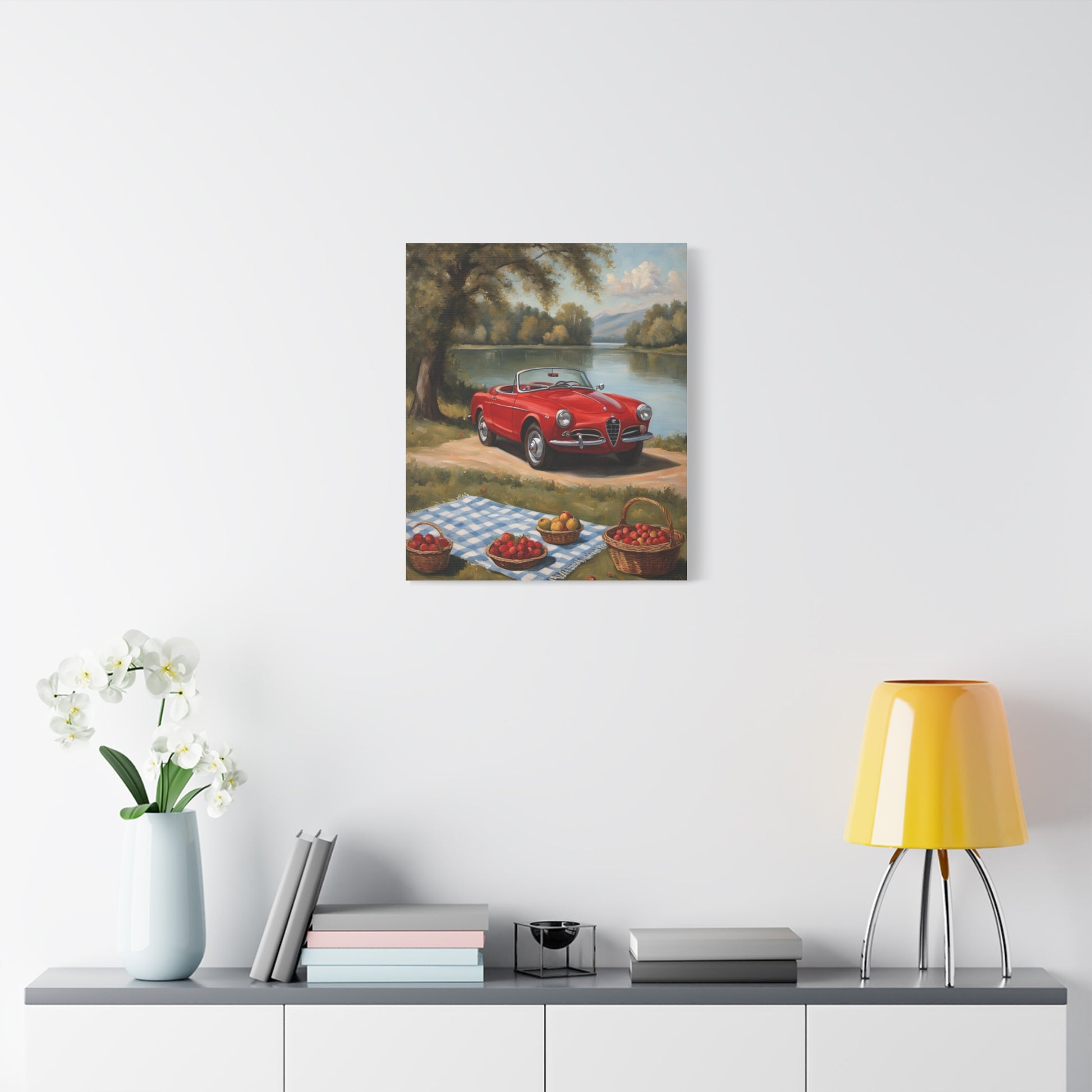 Vintage Car Canvas Wall Art featuring a red car by a lake with a picnic setup