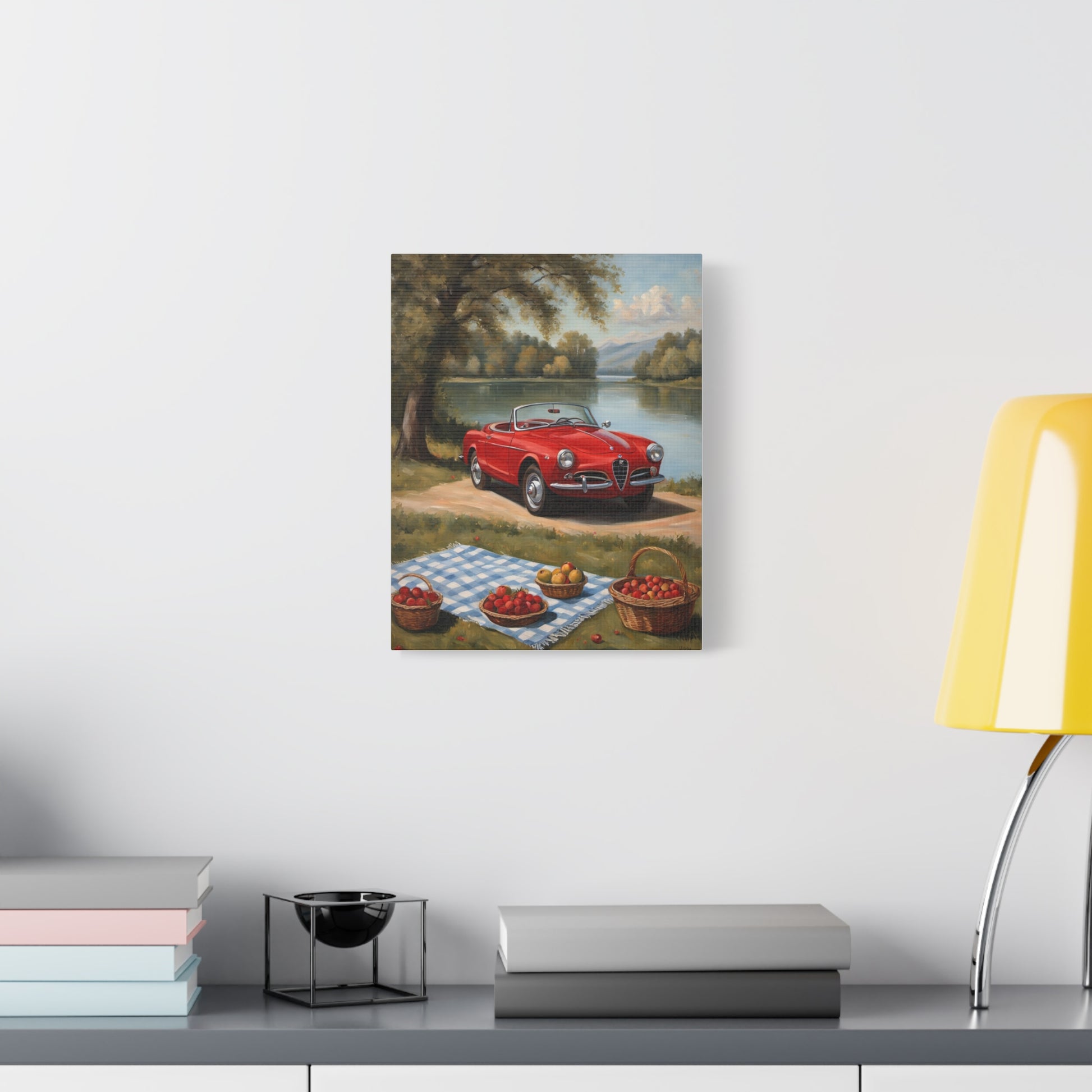 Vintage Car Canvas Wall Art depicting a classic red convertible by a lake with picnic items