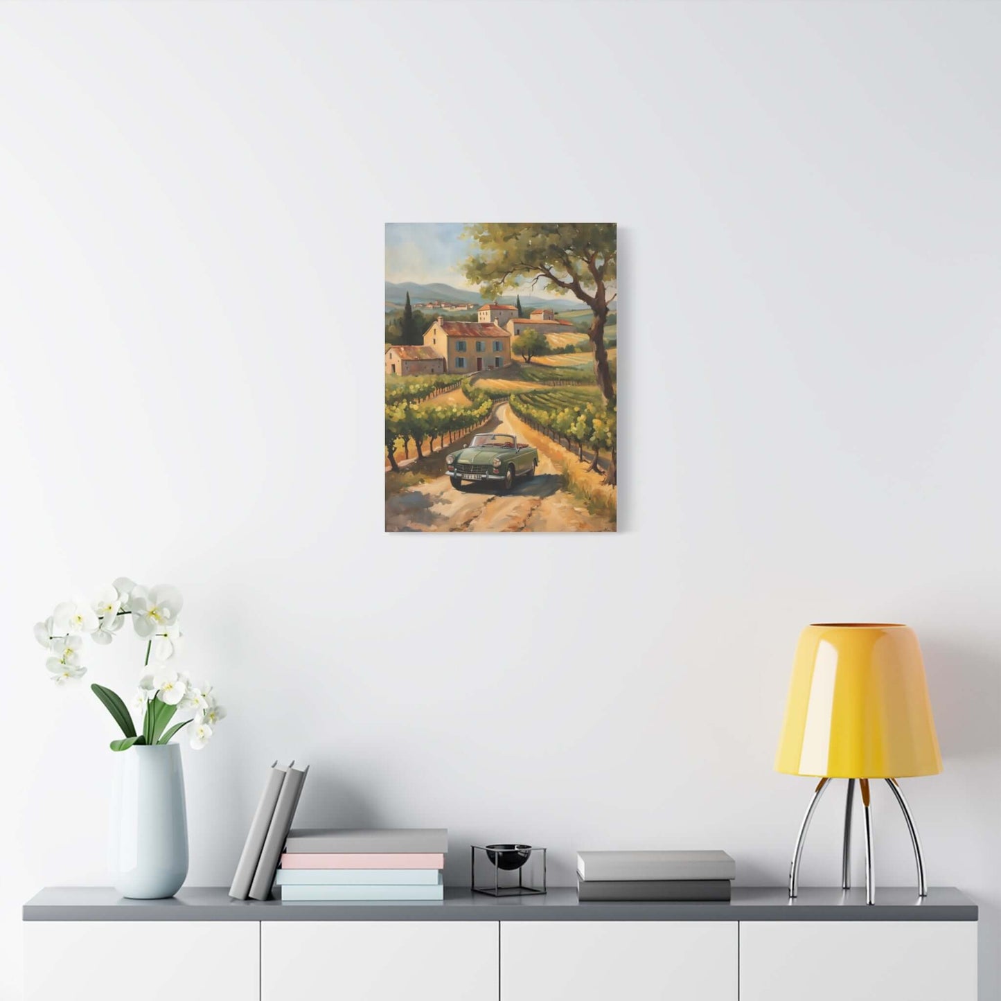 Vintage car landscape canvas art featuring a scenic vineyard view with a classic car on a winding road