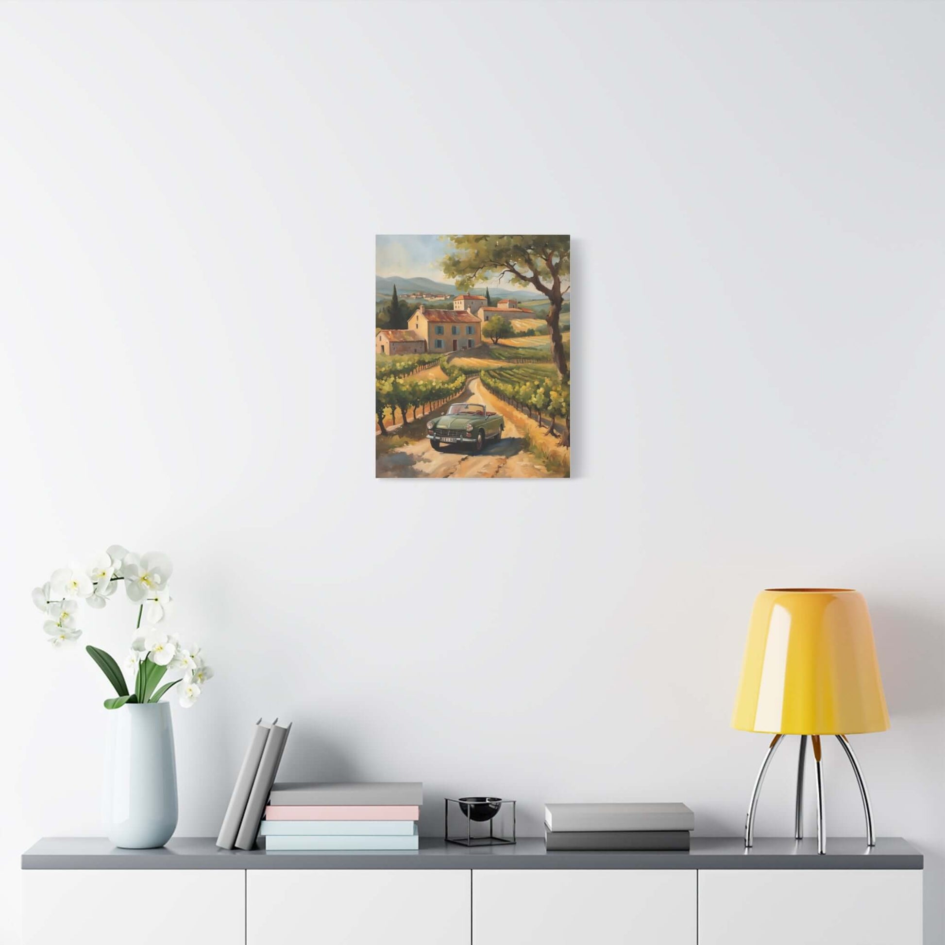 Vintage car landscape canvas art featuring a scenic road with vineyards and a home in the background