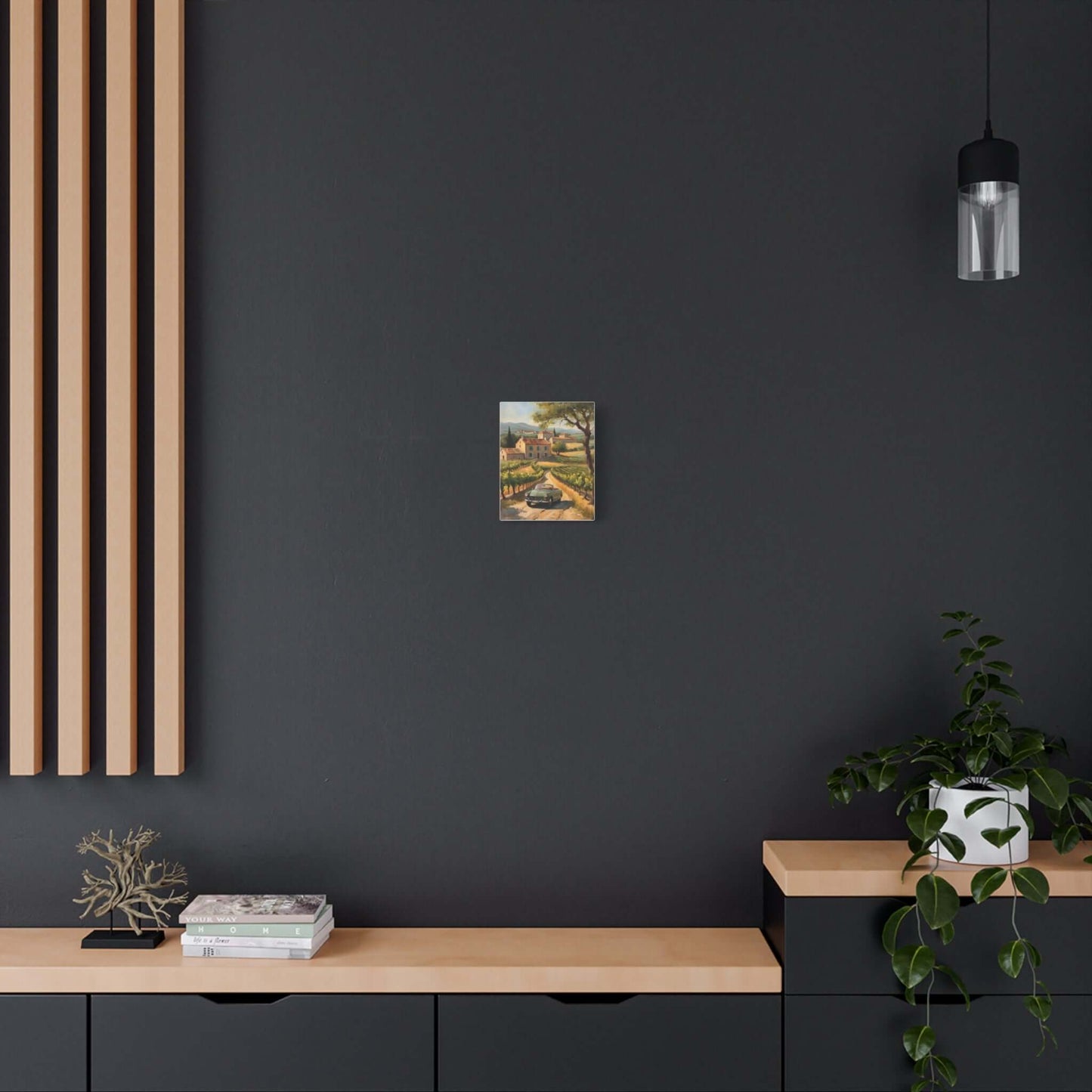 Vintage car landscape canvas art displayed on a modern black wall above wooden furniture