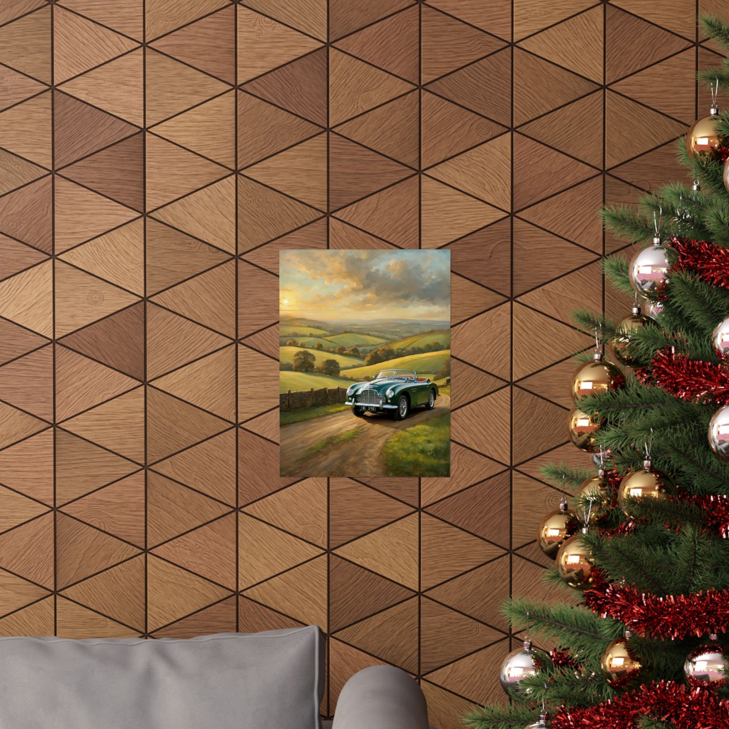 Vintage Car Landscape Poster displayed on a wooden wall above a gray couch during the festive season