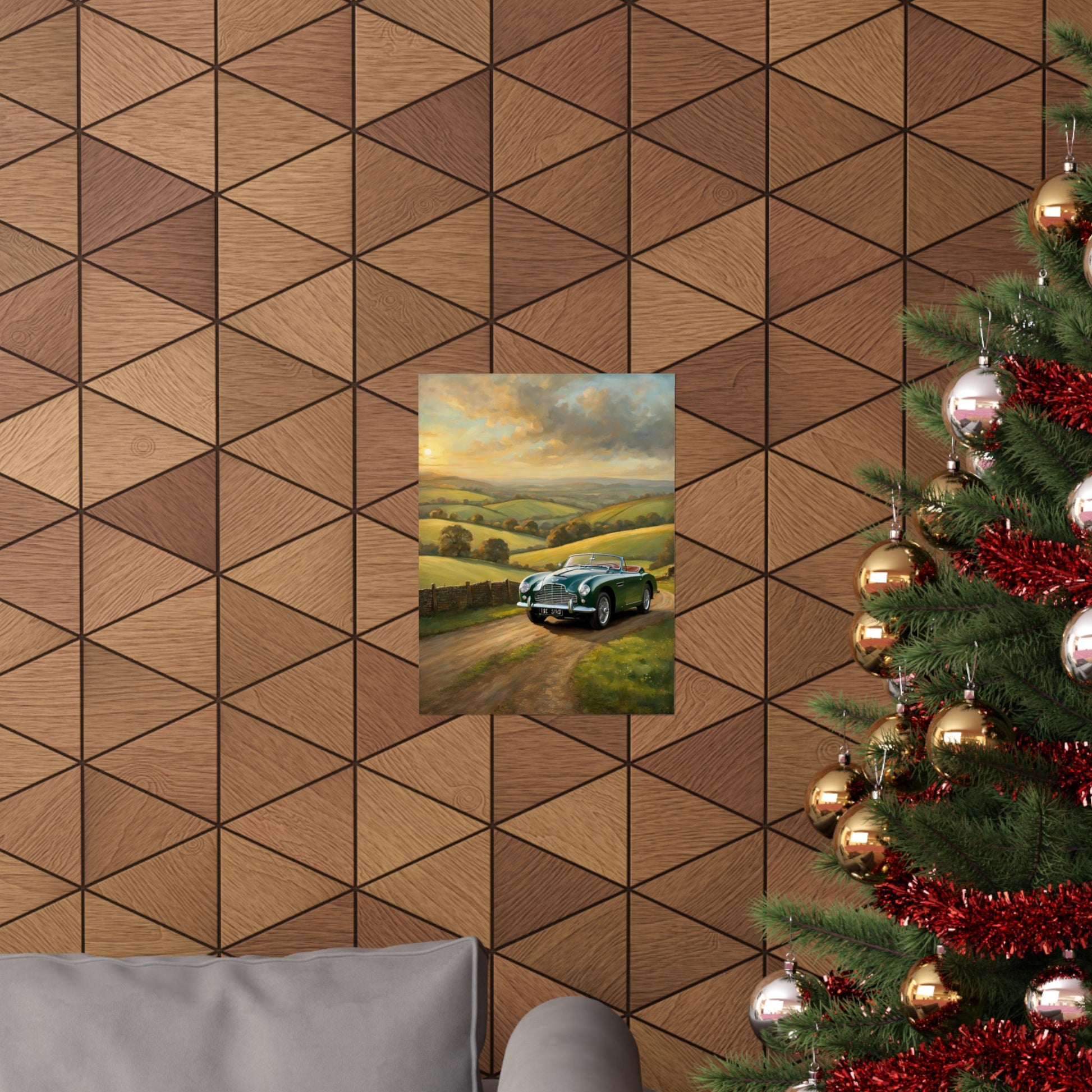 Vintage Car Landscape Poster displayed on a wooden wall above a gray couch during the festive season