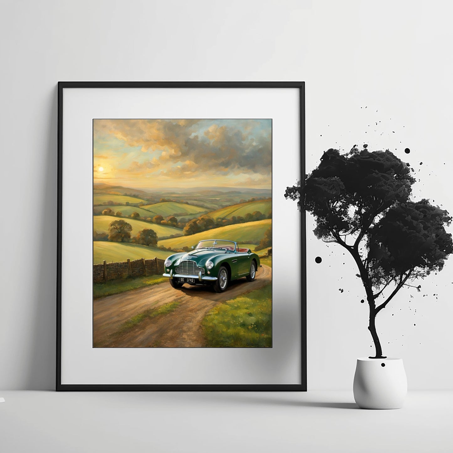 Framed vintage car sunset artwork featuring a green classic convertible on a country road at sunset