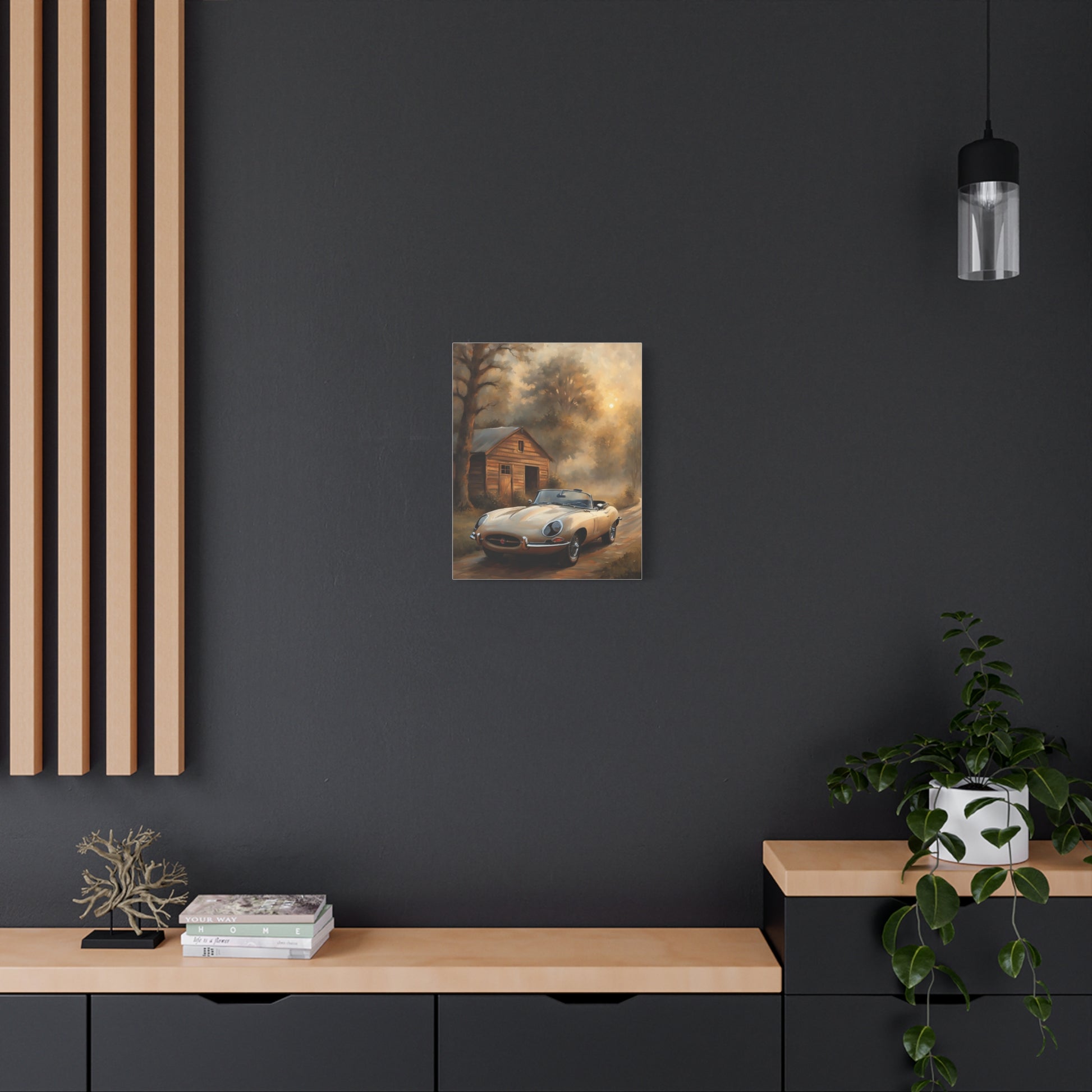Vintage Car Wall Art displayed on a dark wall above a wooden console table with plants