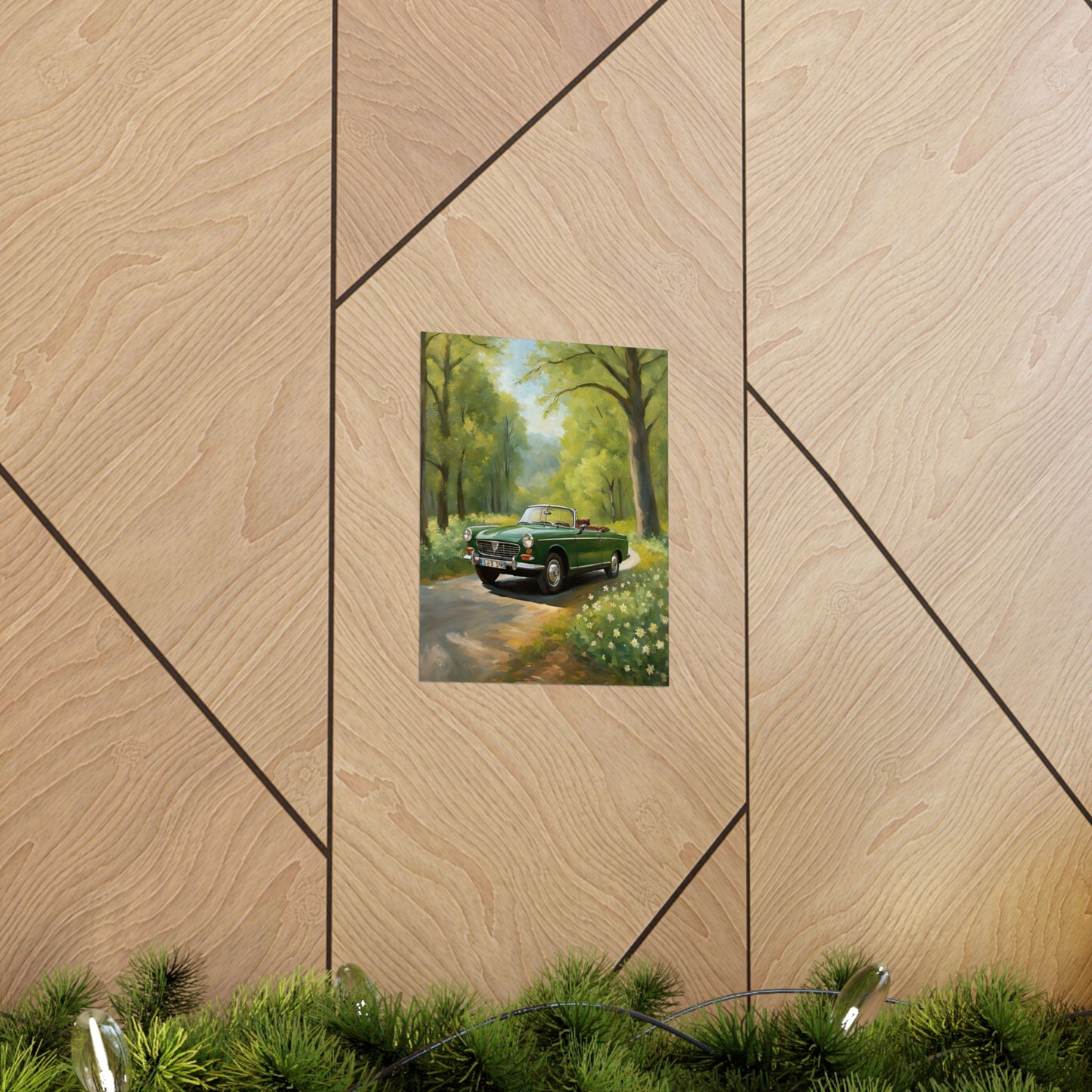 Vintage Convertible Car Art Print displayed on wooden wall with greenery in foreground