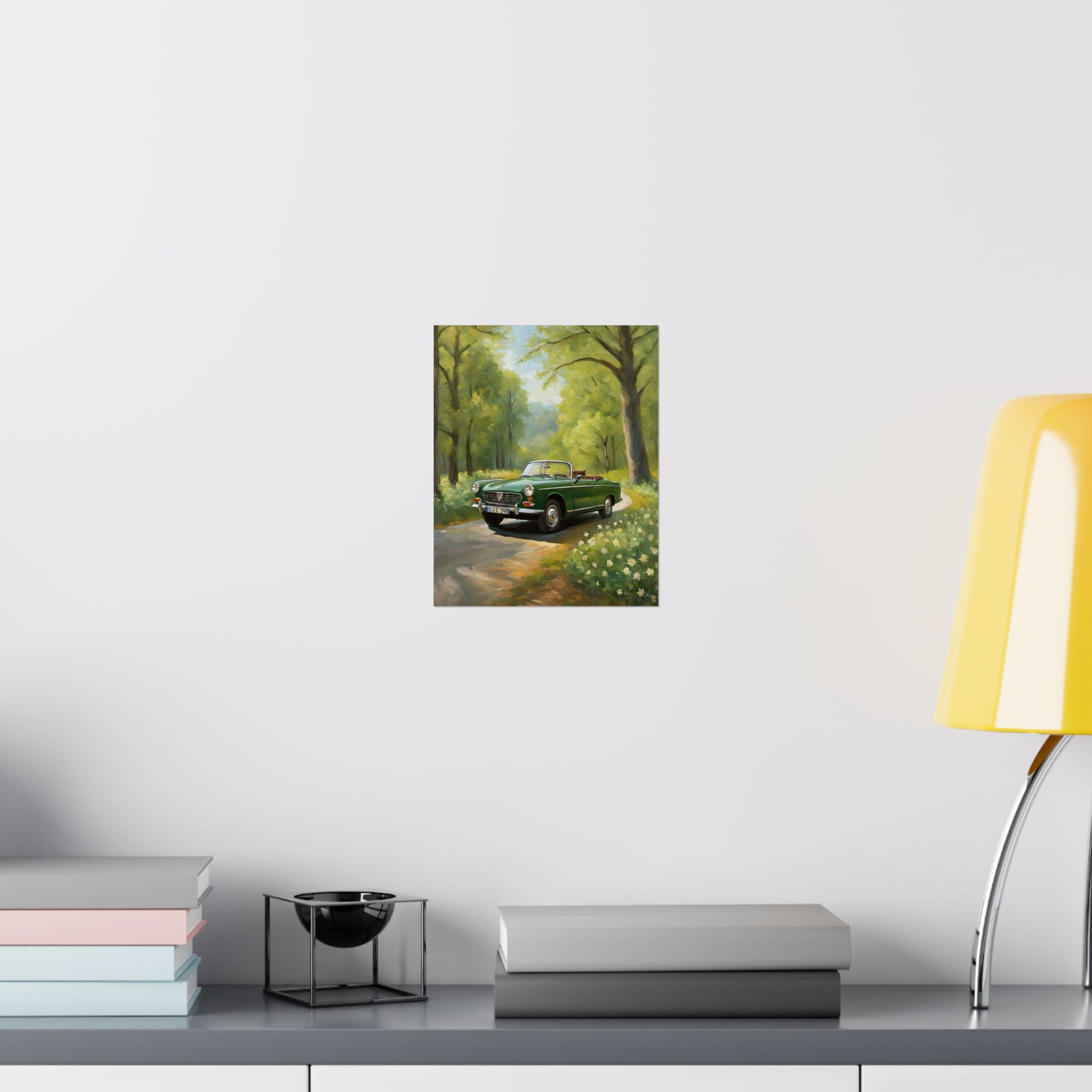Vintage Convertible Car Art Print displayed on a wall above a modern desk and lamp