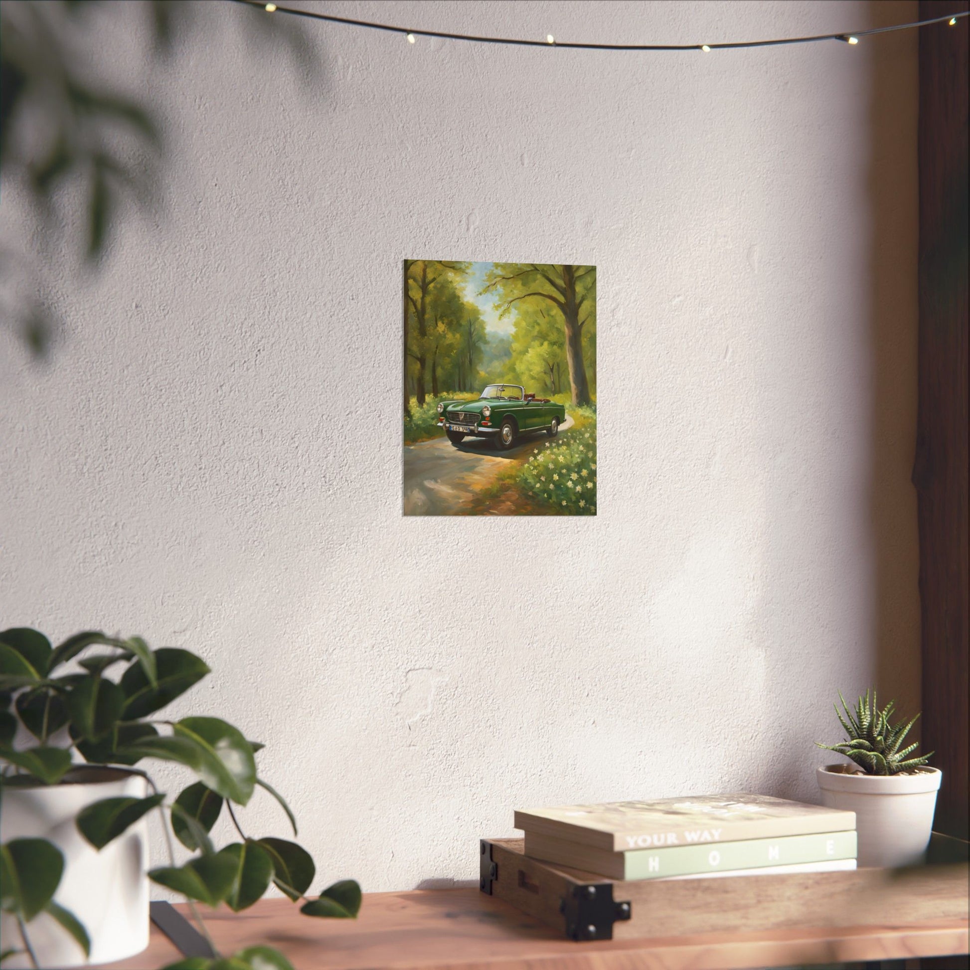 Vintage Convertible Car Art Print displayed on a wall with a cozy indoor setting and greenery