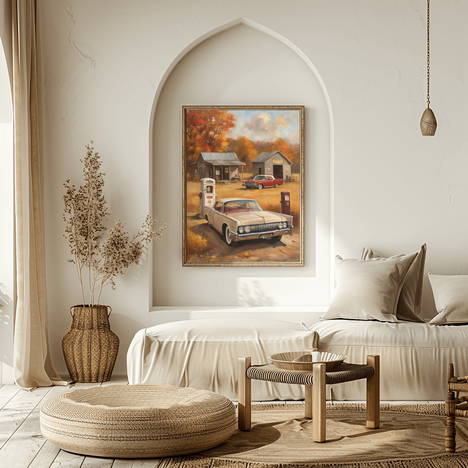 Vintage gas station artwork featuring classic cars and autumn scenery displayed in a cozy modern living room