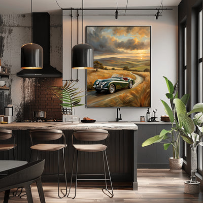 vintage roadster oil painting hanging on wall in modern kitchen with dark cabinetry and pendant lights